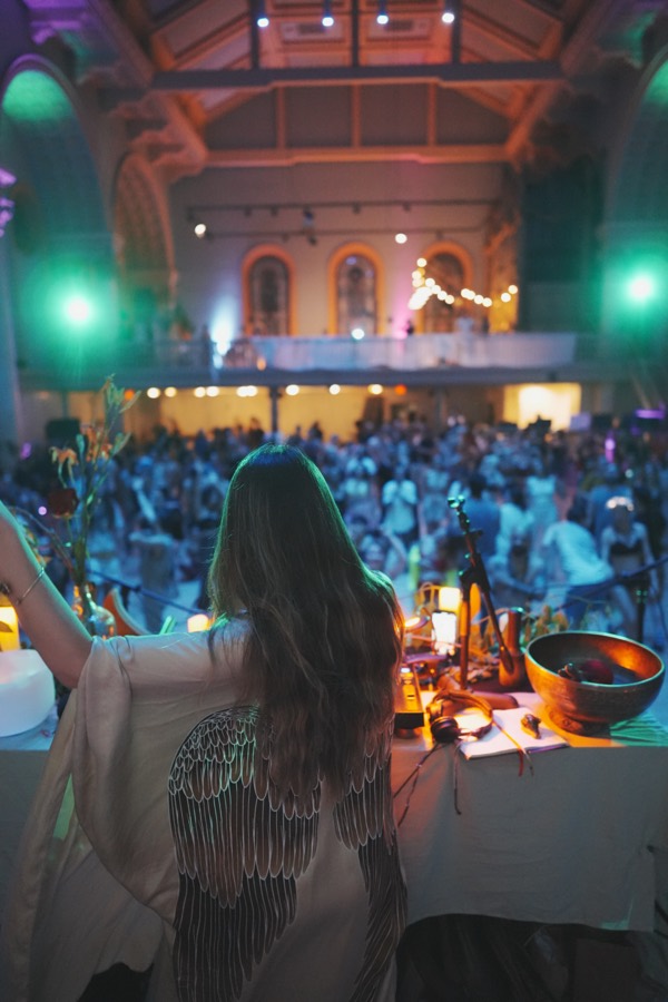 Marsseia facing a full hall of dancers from the DJ booth