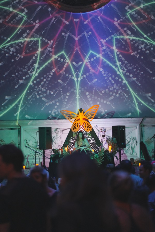 A crowd dancing in front of Marsseia's altar-like DJ stage