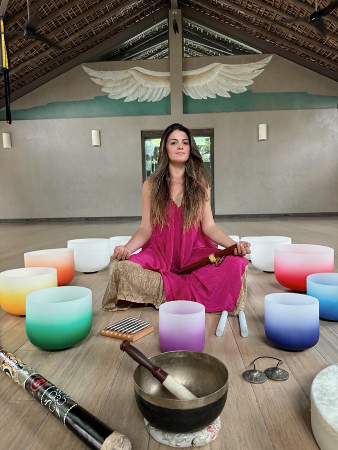 Marsseia seated among crystal singing bowls